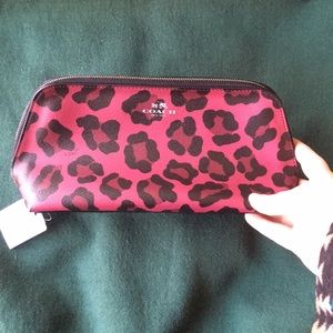 Coach cranberry colored leopard print bag